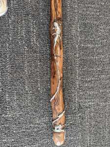 Jerome Lyons, carved timber rainstick with applied pewter lizard, 2004.