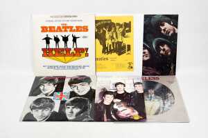 Six Beatles vinyl records