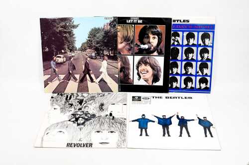 Five Beatles vinyl records