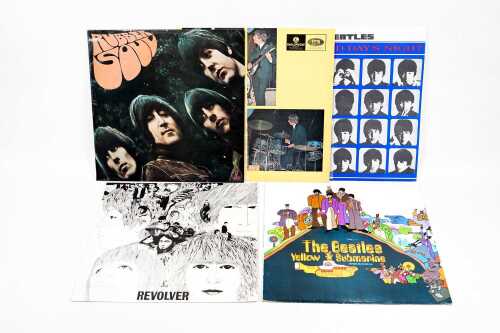 Five Beatles vinyl records