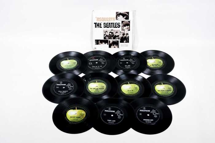 Twelve Beatles and related 7" vinyl records