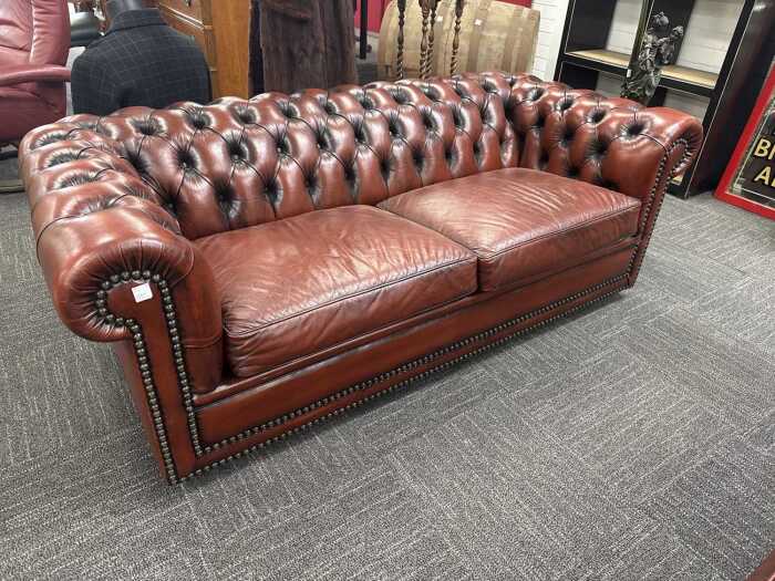 Brown leather Chesterfield two-seater sofa
