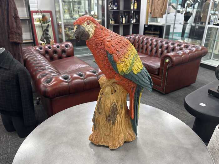 Glazed plaster macaw figure