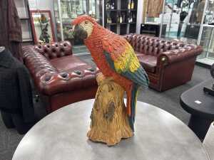 Glazed plaster macaw figure