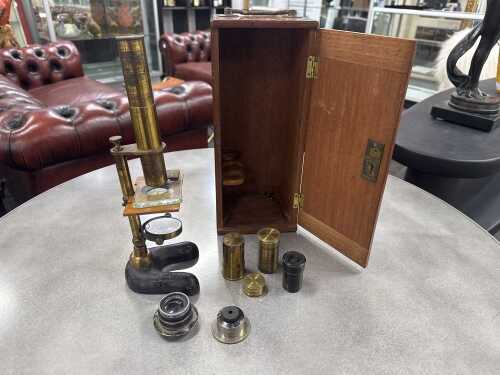 Antique microscope with assorted lenses