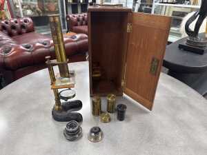 Antique microscope with assorted lenses