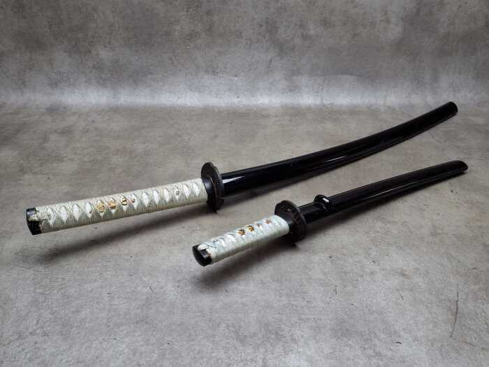 Two decorative Japanese katana swords (requires a weapons-edge license)