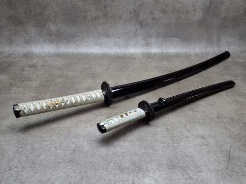 Two decorative Japanese katana swords (requires a weapons-edge license)
