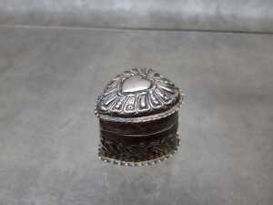 An antique carved box in sterling silver.