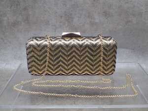 Designer- style clutch purse in gold and black chevron pattern
