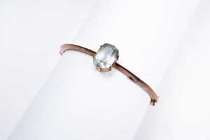 An antique aquamarine bangle in 9 carat rose gold