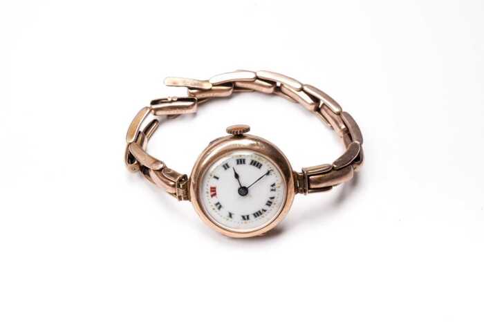 An antique watch in 9 carat yellow gold