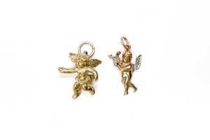 Two cherub charms in 9 carat yellow gold