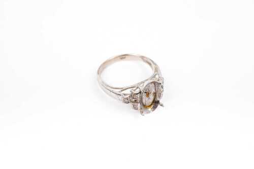 A diamond ring setting in 9 carat white gold