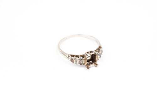 A empty ring setting in 9 carat white gold