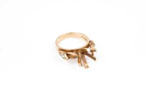 An empty ring setting in 14ct yellow gold