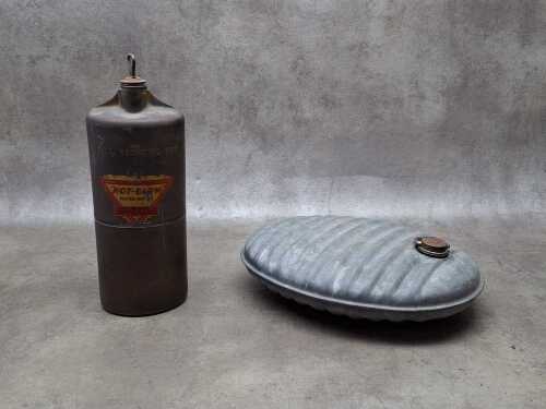 Two vintage metal hot water bottles