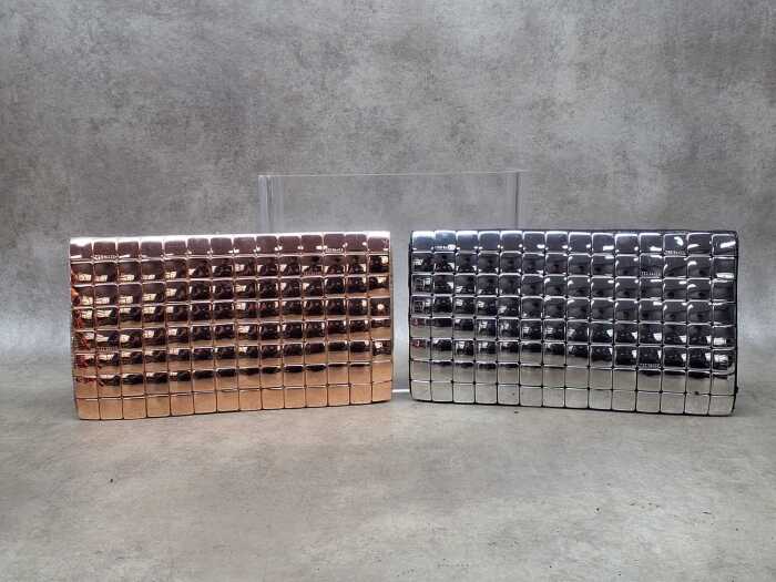 Two designer-style clutch purses