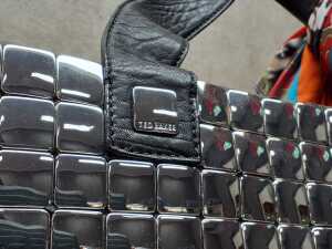 Designer-style silver tone handbag with floral lining - 2