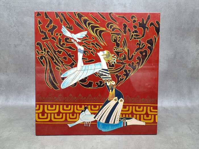 Black and red lacquer panel featuring a kneeling woman releasing a dove