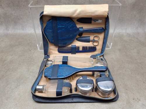 Vintage lady's toiletry set in leather travel case, with moire silk lining