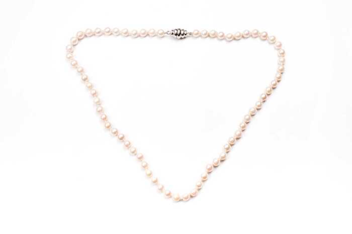 A strand of cultured pearls to a sterling silver clasp