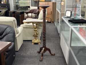 A barley twist timber pedestal
