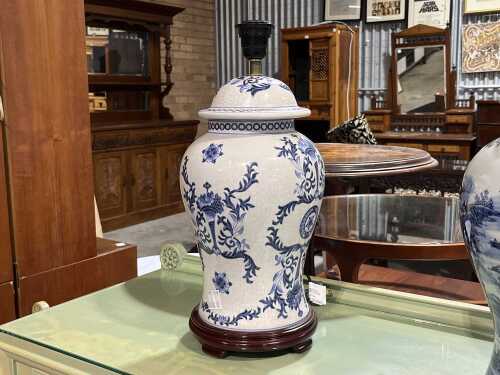 Oriental-style blue and white ceramic lamp with timber base.