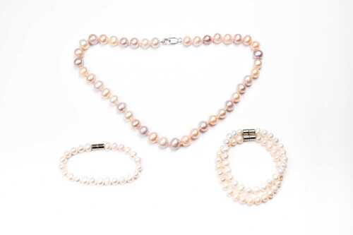 A dyed freshwater pearl necklace with silver clasp and three bracelets