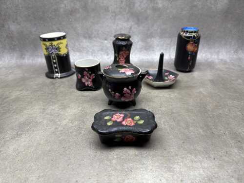Six antique pieces with various decorations on matte black ground