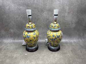 Pair of Chinese-style yellow and blue lamps with fabric shades.