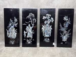 Four Chinese black lacquer panels