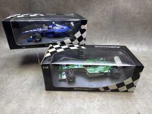 Two Minichamps model cars, Jaguar and Peugeot