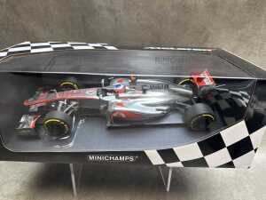 Two McLaren Minichamps 2007 and 2012 model cars - 2