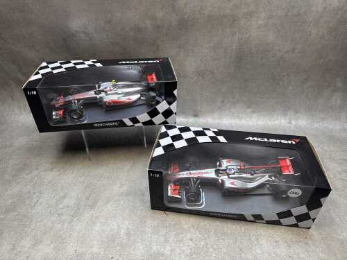 Two McLaren Minichamps 2010 and 2011 model cars