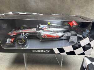 Two McLaren Minichamps 2010 and 2011 model cars - 2