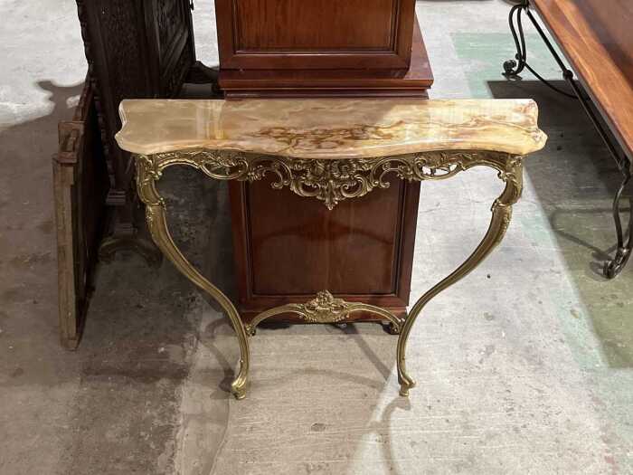 Ornate gilt metal console table with marble top