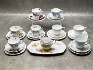 Eight English porcelain trios, together with a sandwich plate and creamer