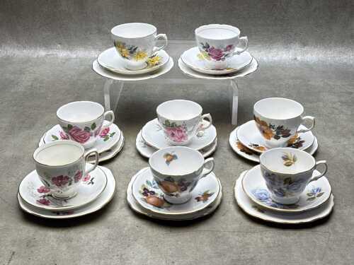 Eight English porcelain trios