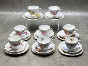 Eight English porcelain trios