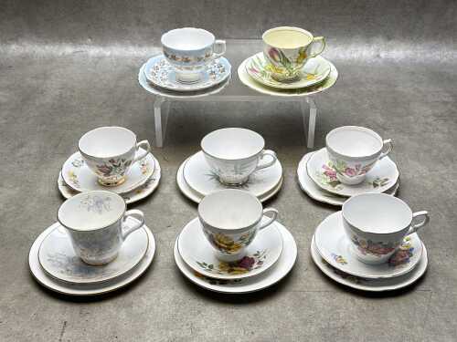Eight English porcelain trios