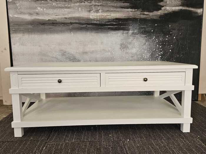 White modern rectangular coffee table with cross-braced sides