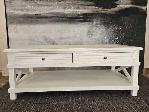 White modern rectangular coffee table with cross-braced sides