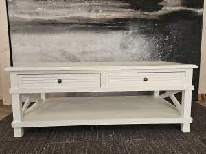 White modern rectangular coffee table with cross-braced sides