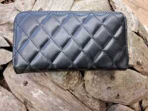 Designer-style black quilted purse with gold-tone hardware. - 2