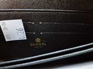 Designer-style black quilted purse with gold-tone hardware. - 4
