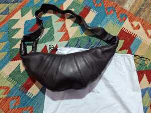 Designer-style brown handbag with stitch detail