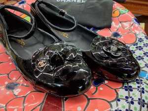 Designer-style black patent ballet flats with slip bag. - 2