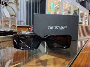 Designer-style sunglasses with original pouch and box.