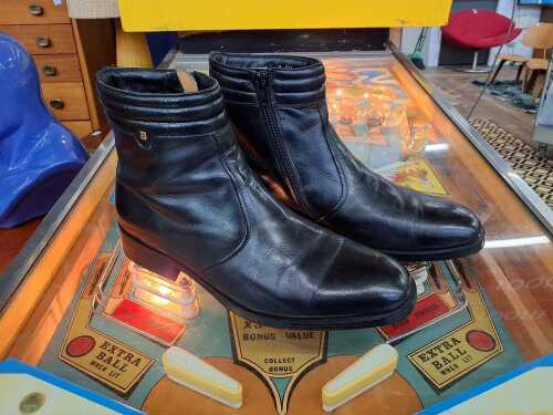 Designer-style leather ankle boots with side zipper, size 9US.
